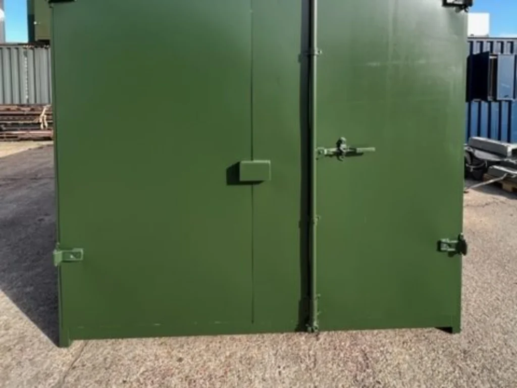 Used green 10ft cut down storage container with flat panel double doors closed