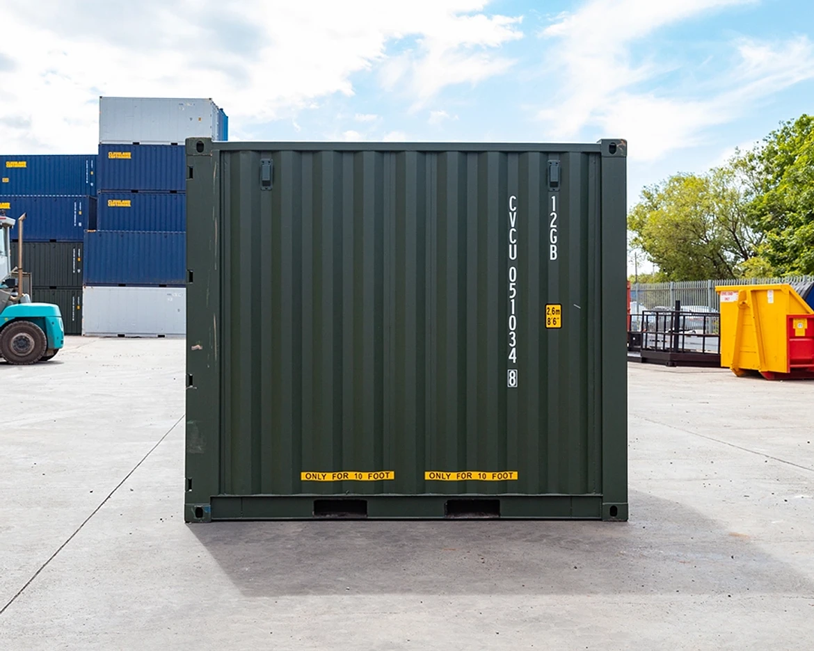 Side view of a new green 10ft shipping container